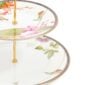 Close-up shot of Wedgwood Hummingbird 2-Tier Cake Stand defined by expressive floral motifs and an artfully sculpted bird finial finished with 22-carat gold detailing | Kneen & Co
