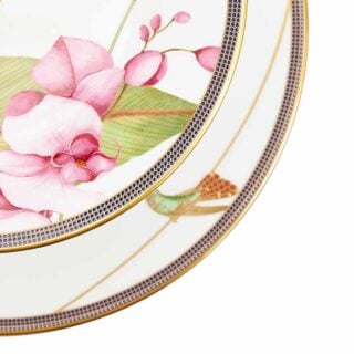 701587439756-Wedgwood-Hummingbird-2-Tier-Cake-Stand-detail3-1200×1200-100KB Close-up shot of Wedgwood Hummingbird 2-Tier Cake Stand defined by expressive floral motifs and an artfully sculpted bird finial finished with 22-carat gold detailing | Kneen & Co