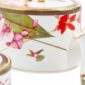 Close-up shot of Wedgwood Hummingbird 3-piece Teaware Set defined by expressive floral motifs and an artfully sculpted bird finial finished with 22-carat gold detailing | Kneen & Co
