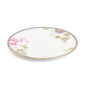 Close-up shot of Wedgwood Hummingbird Dinner Plate defined by expressive floral motifs and an artfully sculpted bird finial finished with 22-carat gold detailing | Kneen & Co