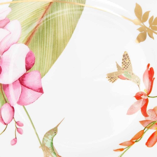 Close-up shot of Wedgwood Hummingbird Salad Plate defined by expressive floral motifs and an artfully sculpted bird finial finished with 22-carat gold detailing | Kneen & Co