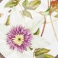 Close-up shot of Wedgwood Hummingbird Plate defined by expressive floral motifs and an artfully sculpted bird finial finished with 22-carat gold detailing | Kneen & Co