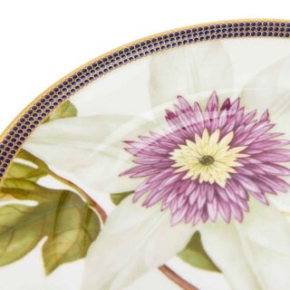 701587439800-Wedgwood-Hummingbird-Plate-15pt4cm-6in-detail2-1200×1200-100KB Close-up shot of Wedgwood Hummingbird Plate defined by expressive floral motifs and an artfully sculpted bird finial finished with 22-carat gold detailing | Kneen & Co