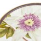 Close-up shot of Wedgwood Hummingbird Plate defined by expressive floral motifs and an artfully sculpted bird finial finished with 22-carat gold detailing | Kneen & Co
