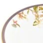Close-up shot of Wedgwood Hummingbird Rim Soup Plate defined by expressive floral motifs and an artfully sculpted bird finial finished with 22-carat gold detailing | Kneen & Co