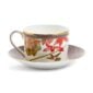 Close-up shot of Wedgwood Hummingbird Tea Cup and Saucer defined by expressive floral motifs and an artfully sculpted bird finial finished with 22-carat gold detailing | Kneen & Co