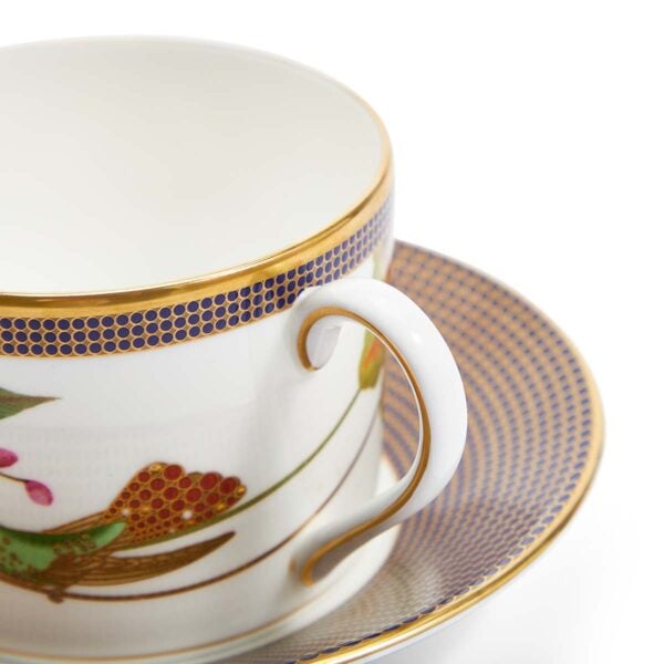701587439824-Wedgwood-Hummingbird-Teacup+Saucer-175ml-5pt9floz-detail-1200x1200-100KB Close-up shot of Wedgwood Hummingbird Tea Cup and Saucer defined by expressive floral motifs and an artfully sculpted bird finial finished with 22-carat gold detailing | Kneen & Co