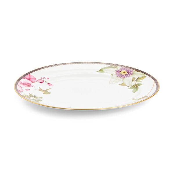 Close-up shot of Wedgwood Hummingbird Oval Platter defined by expressive floral motifs and an artfully sculpted bird finial finished with 22-carat gold detailing | Kneen & Co