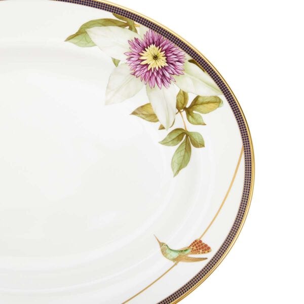 Close-up shot of Wedgwood Hummingbird Oval Platter defined by expressive floral motifs and an artfully sculpted bird finial finished with 22-carat gold detailing | Kneen & Co
