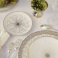 Elegant overhead table setting featuring Christofle Malmaison Impériale porcelain dinnerware | Kneen & Co
