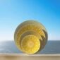 Artistic stacked view of Christofle Malmaison Riviera Dinnerware set in yellow Limoges porcelain | Kneen & Co