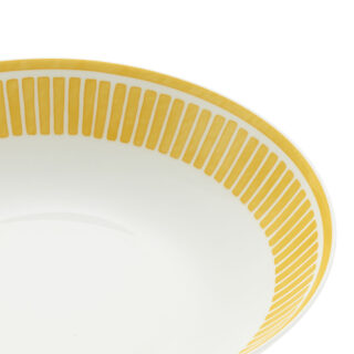 Close-up shot of Christofle Malmaison Riviera Serving Bowl in yellow Limoges porcelain with hand-drawn palmette detailing | Kneen & Co