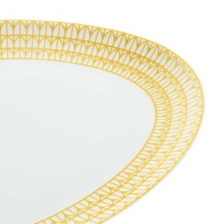 Close-up shot of Christofle Malmaison Riviera Oval Platter in yellow Limoges porcelain with hand-drawn palmette detailing | Kneen & Co