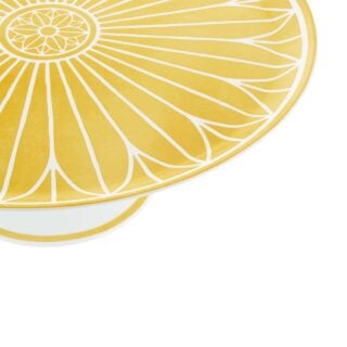 Close-up shot of Christofle Malmaison Riviera Cake Stand in yellow Limoges porcelain with hand-drawn palmette detailing | Kneen & Co