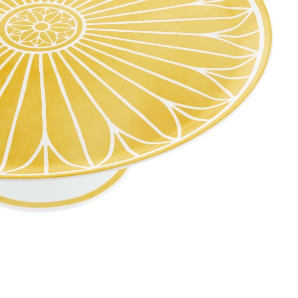 Close-up shot of Christofle Malmaison Riviera Cake Stand in yellow Limoges porcelain with hand-drawn palmette detailing | Kneen & Co