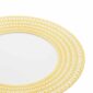 Close-up shot of Christofle Malmaison Riviera Charger Plate in yellow Limoges porcelain with hand-drawn palmette detailing | Kneen & Co
