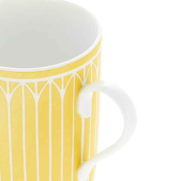 Close-up shot of Christofle Malmaison Riviera Mug in yellow Limoges porcelain with hand-drawn palmette detailing | Kneen & Co