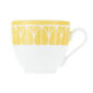 Close-up shot of Christofle Malmaison Riviera Espresso Cup and Saucer in yellow Limoges porcelain with hand-drawn palmette detailing | Kneen & Co