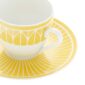 Close-up shot of Christofle Malmaison Riviera Espresso Cup and Saucer in yellow Limoges porcelain with hand-drawn palmette detailing | Kneen & Co