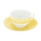 Close-up shot of Christofle Malmaison Riviera Tea Cup and Saucer in yellow Limoges porcelain with hand-drawn palmette detailing | Kneen & Co