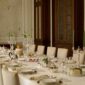 Grand formal dining room setting featuring Christofle Malmaison dinnerware | Kneen & Co