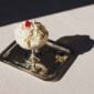 Lifestyle setting featuring a Christofle Malmaison footed dessert bowl in silver plate | Kneen & Co