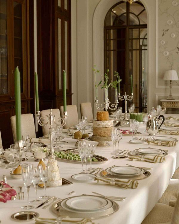 CHRISTOFLE-NewMalmaison-Mood-2026-RGB-HD-2-1200w-100KB Grand formal dining room setting featuring Christofle Malmaison dinnerware and crystal glassware | Kneen & Co