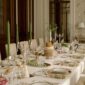 Grand formal dining room setting featuring Christofle Malmaison dinnerware and crystal glassware | Kneen & Co