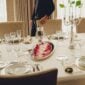 Elegant formal dining room setting featuring a Christofle Malmaison dinnerware | Kneen & Co