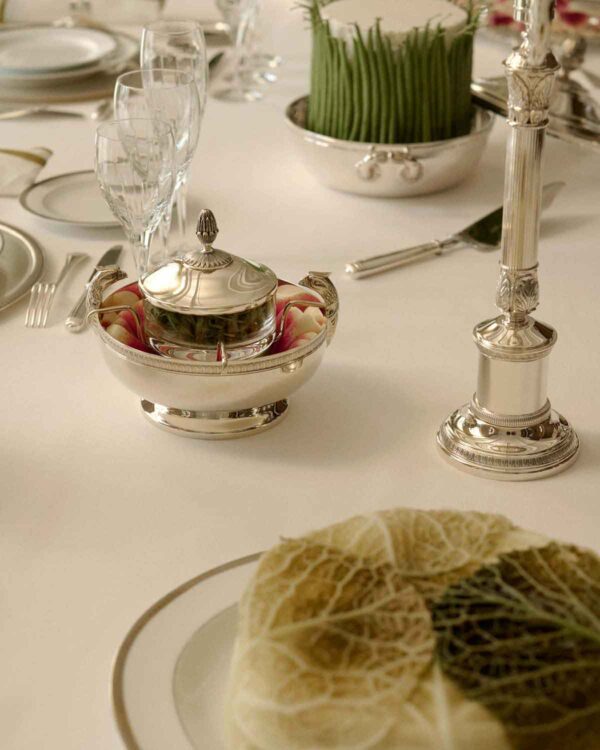 CHRISTOFLE-NewMalmaison-Mood-2026-RGB-HD-9-1200w-100KB Elegant formal setting featuring a Christofle Malmaison Silver Plated Caviar Set | Kneen & Co