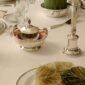 Elegant formal setting featuring a Christofle Malmaison Silver Plated Caviar Set | Kneen & Co