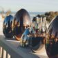 Scenic outdoor setting of the Christofle Mood Flatware Set in an egg-shaped storage | Kneen & Co