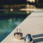Scenic outdoor setting of the Christofle Mood Flatware Set in an egg-shaped storage | Kneen & Co
