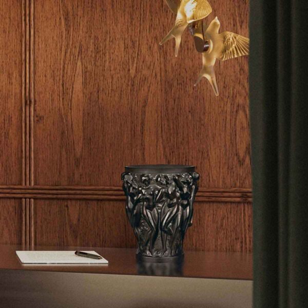 LALIQUE-10547100-bacchantes-vase-bronze-Lifestyle-image-1200w-100KB Lalique Bacchantes Vase Bronze set on table | Kneen & Co