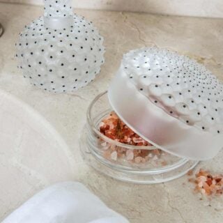 Lalique Cactus Perfume Bottle set on table | Kneen & Co
