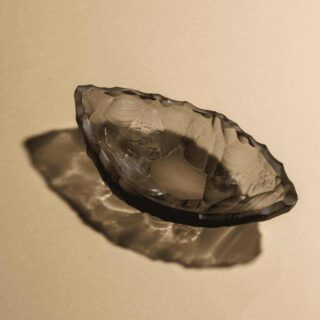 Lalique Silex Small Bowl Gray set on table | Kneen & Co