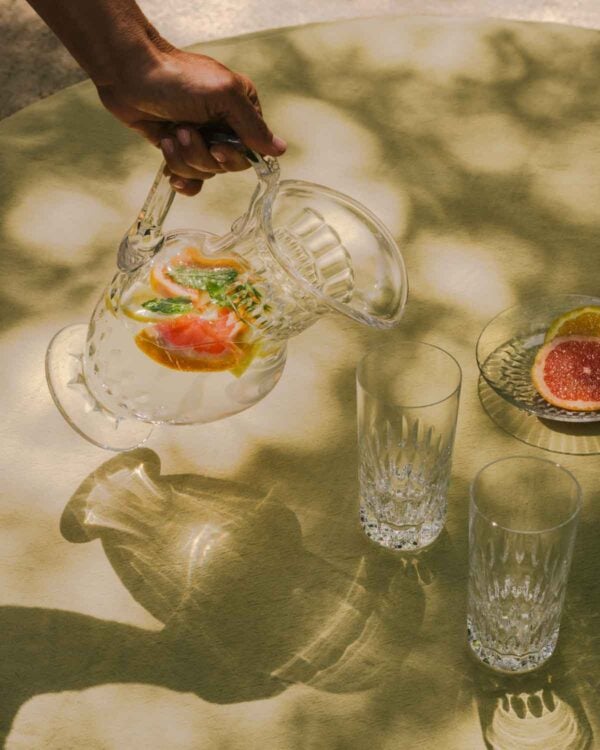 Saint-Louis Crystal Stella Water Jug and Highball on table | Kneen & Co