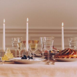 Saint Louis Crystal Apollo Gold Rim and Thistle Glassware on a festive table | Kneen & Co