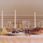 Saint Louis Crystal Apollo Gold Rim and Thistle Glassware on a festive table | Kneen & Co