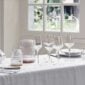 Saint-Louis Crystal Folia Stemware and Lamps on a table | Kneen & Co