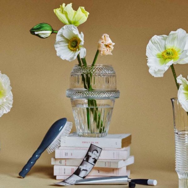 Saint-Louis Crystal Matrice Vase Medium with flowers on books | Kneen & Co