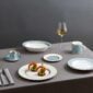 Modern dinner setting with Wedgwood Helia Dinnerware in fine bone china with 22-carat gold trim and blue pinstripe borders | Kneen & Co