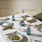 Modern dinner setting with Wedgwood Helia Dinnerware in fine bone china with 22-carat gold trim and blue pinstripe borders | Kneen & Co