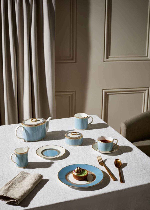 Wedgwood-Helia-Lifestyle-4-2023-1200w-100KB Modern dinner setting with Wedgwood Helia Dinnerware in fine bone china with 22-carat gold trim and blue pinstripe borders | Kneen & Co