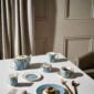 Modern dinner setting with Wedgwood Helia Dinnerware in fine bone china with 22-carat gold trim and blue pinstripe borders | Kneen & Co