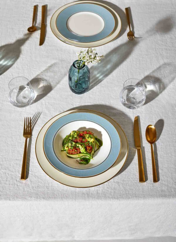 Wedgwood-Helia-Lifestyle-6-2023-1200w-100KB Modern dinner setting with Wedgwood Helia Dinnerware in fine bone china with 22-carat gold trim and blue pinstripe borders | Kneen & Co