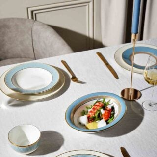 Wedgwood-Helia-Lifestyle-7-2023-1200w-100KB Modern dinner setting with Wedgwood Helia Dinnerware in fine bone china with 22-carat gold trim and blue pinstripe borders | Kneen & Co