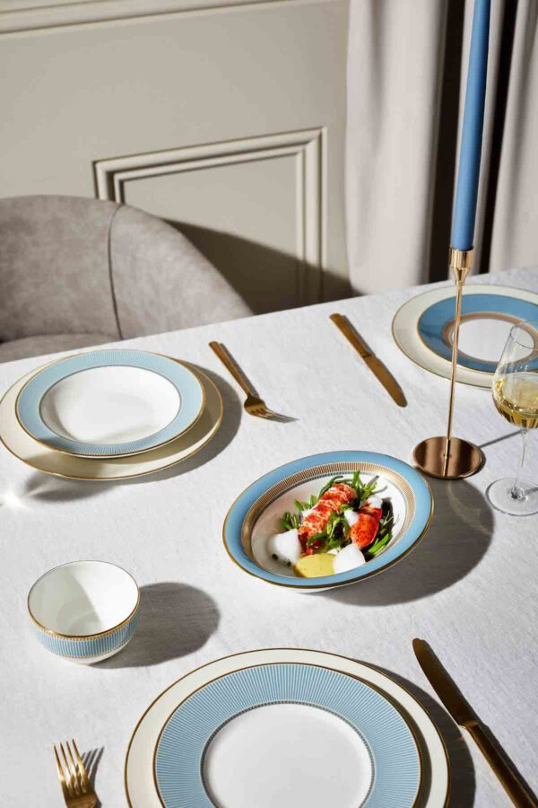 Modern dinner setting with Wedgwood Helia Dinnerware in fine bone china with 22-carat gold trim and blue pinstripe borders | Kneen & Co