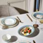Modern dinner setting with Wedgwood Helia Dinnerware in fine bone china with 22-carat gold trim and blue pinstripe borders | Kneen & Co