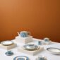 Modern dinner setting with Wedgwood Helia Dinnerware in fine bone china with 22-carat gold trim and blue pinstripe borders | Kneen & Co